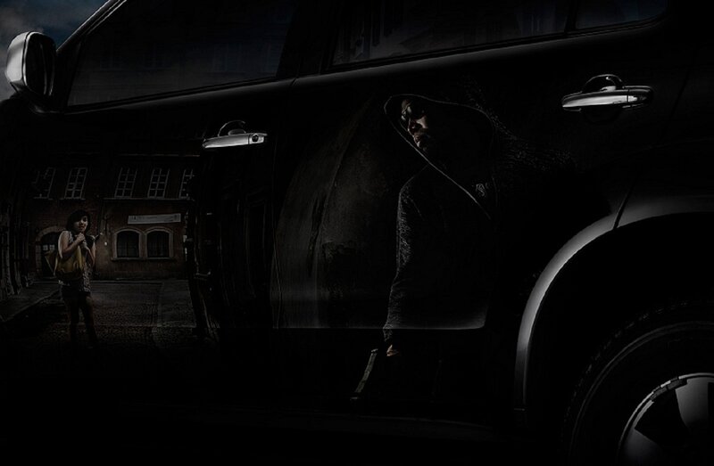 Man in Hoodie by Car