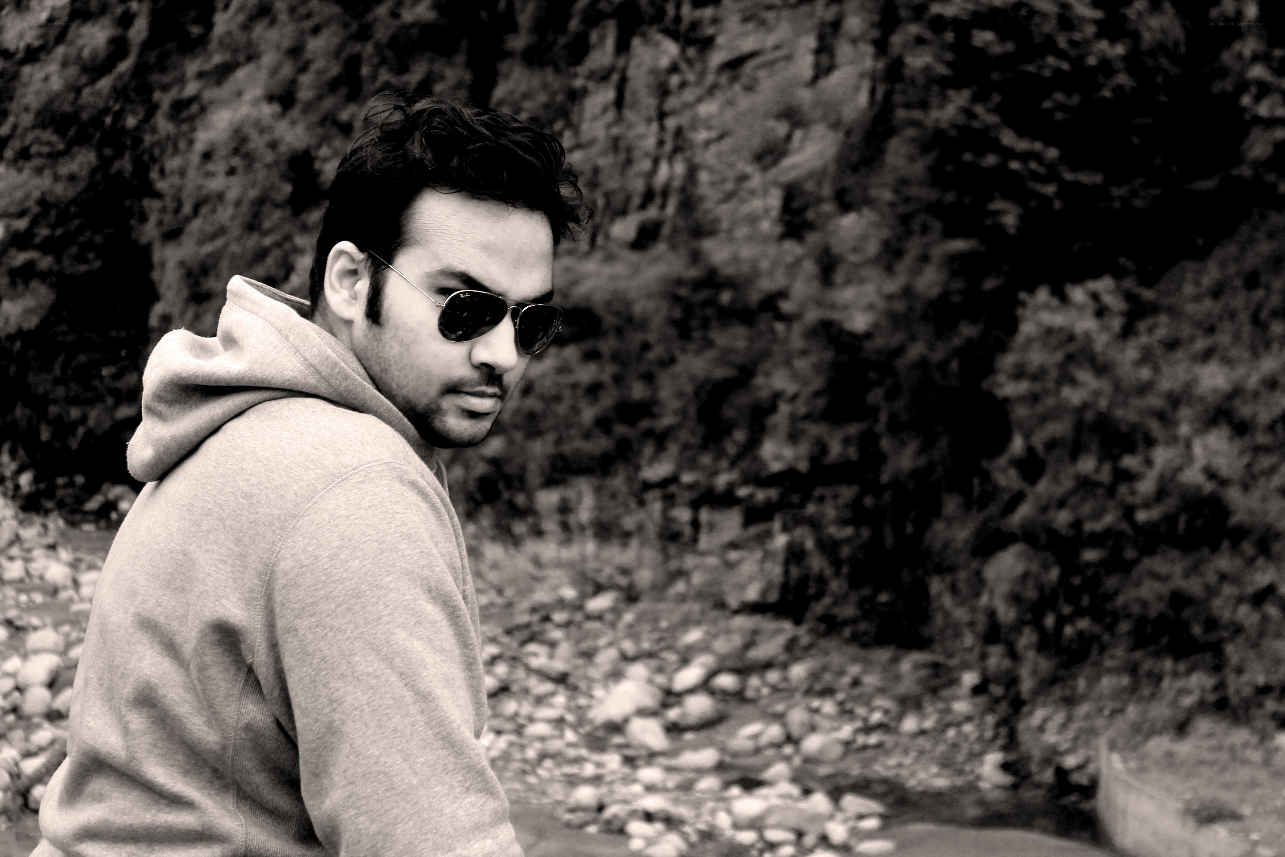 man in hoodie by river