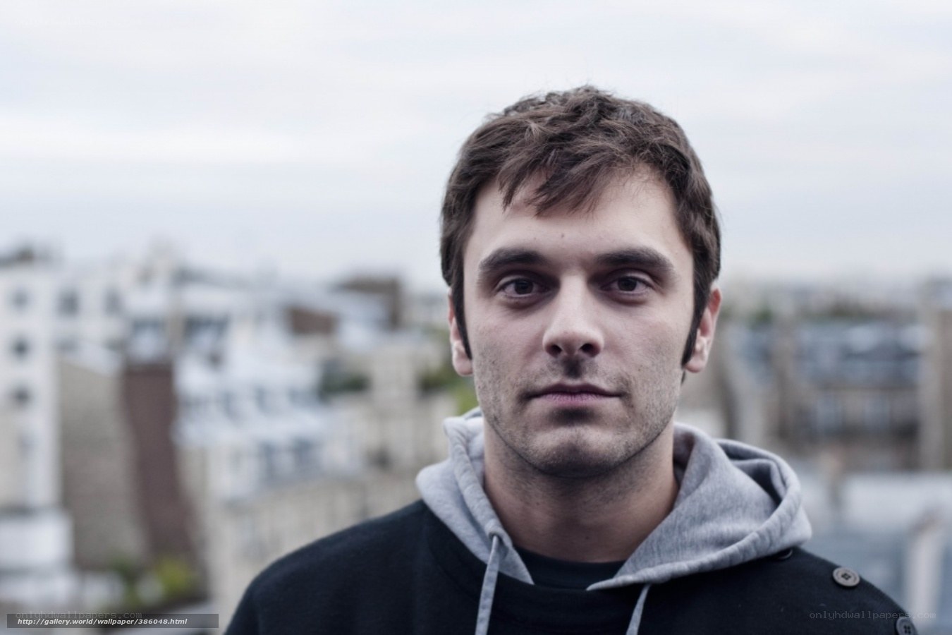 man in hoodie looking at camera