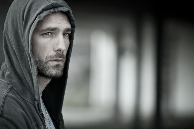 man in hoodie looking away