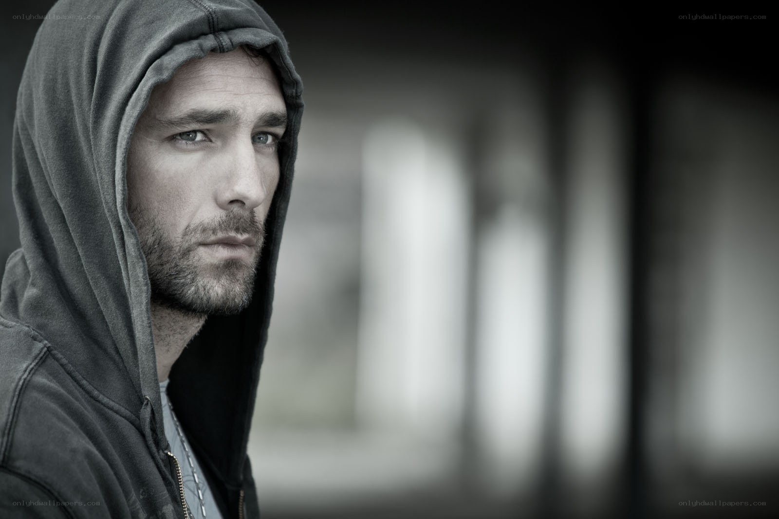 man in hoodie looking away