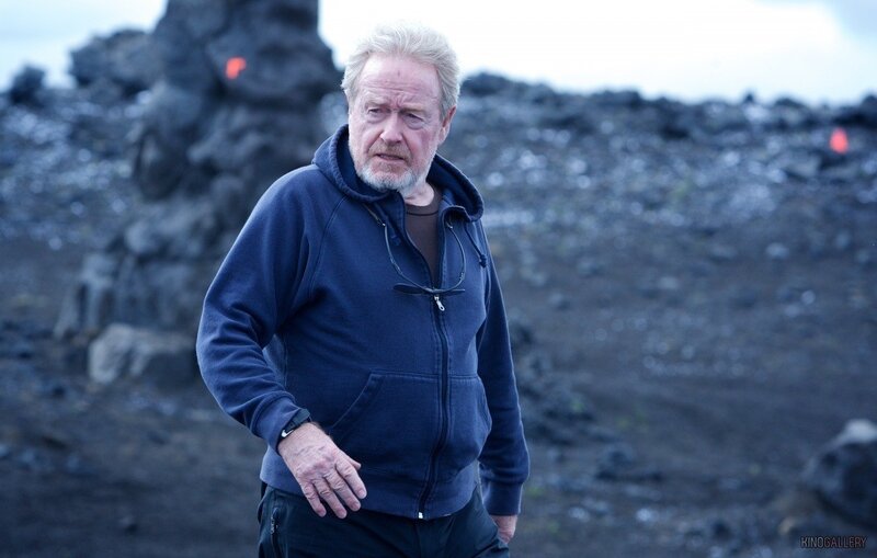man in hoodie on volcanic field