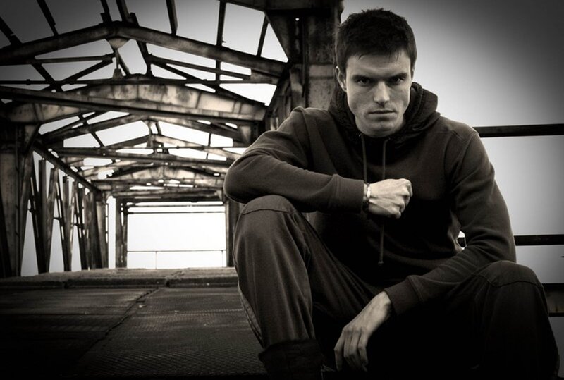 Man in Hoodie Sitting