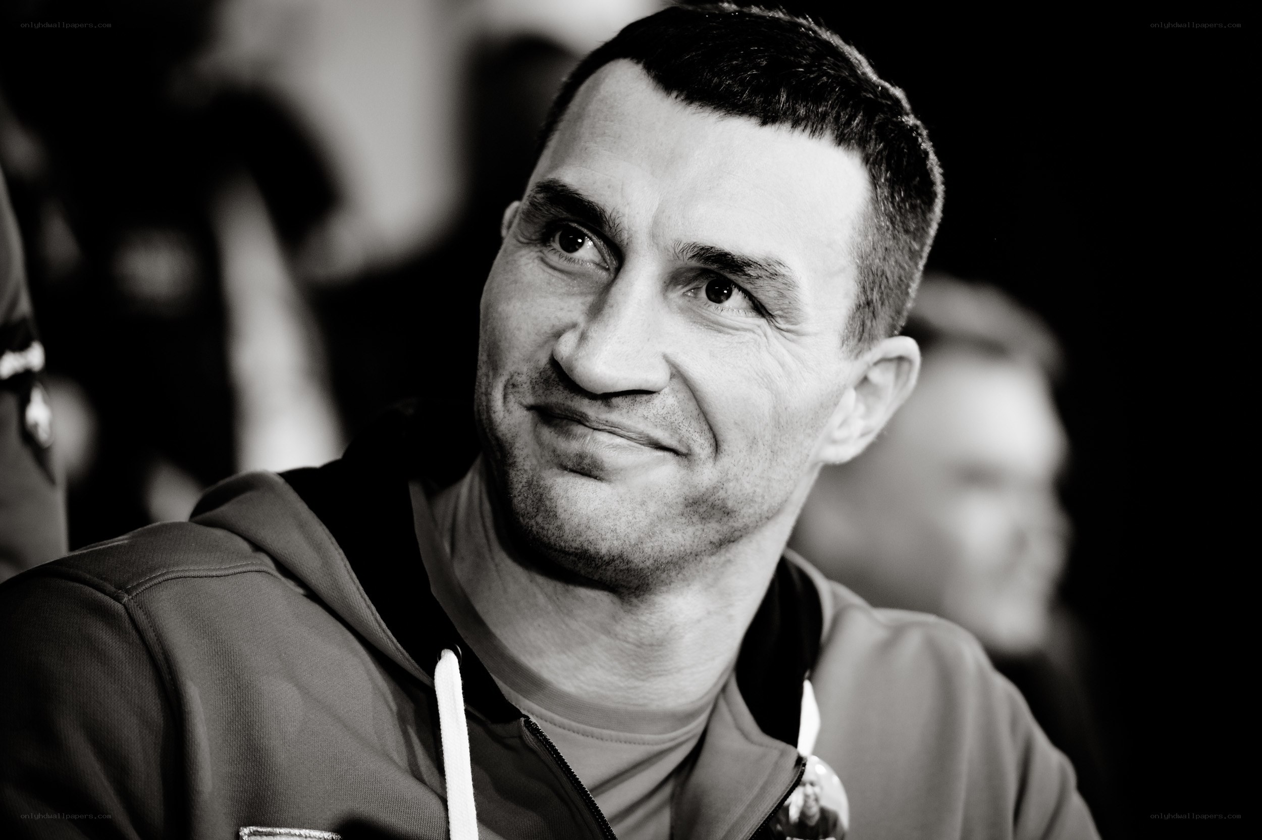 man in hoodie smiling