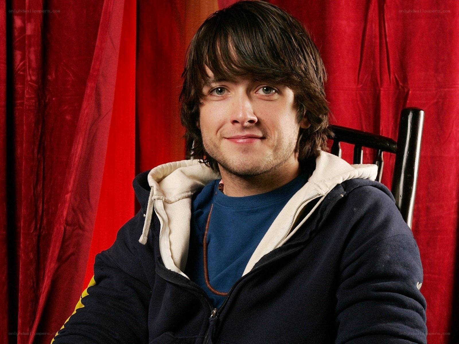 man in hoodie smiling