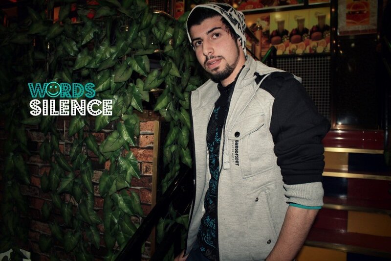 Man in hoodie with green plants