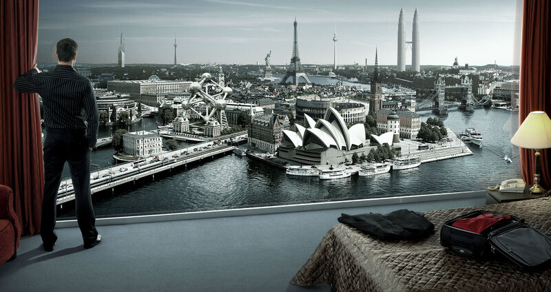 Man in hotel room with city view