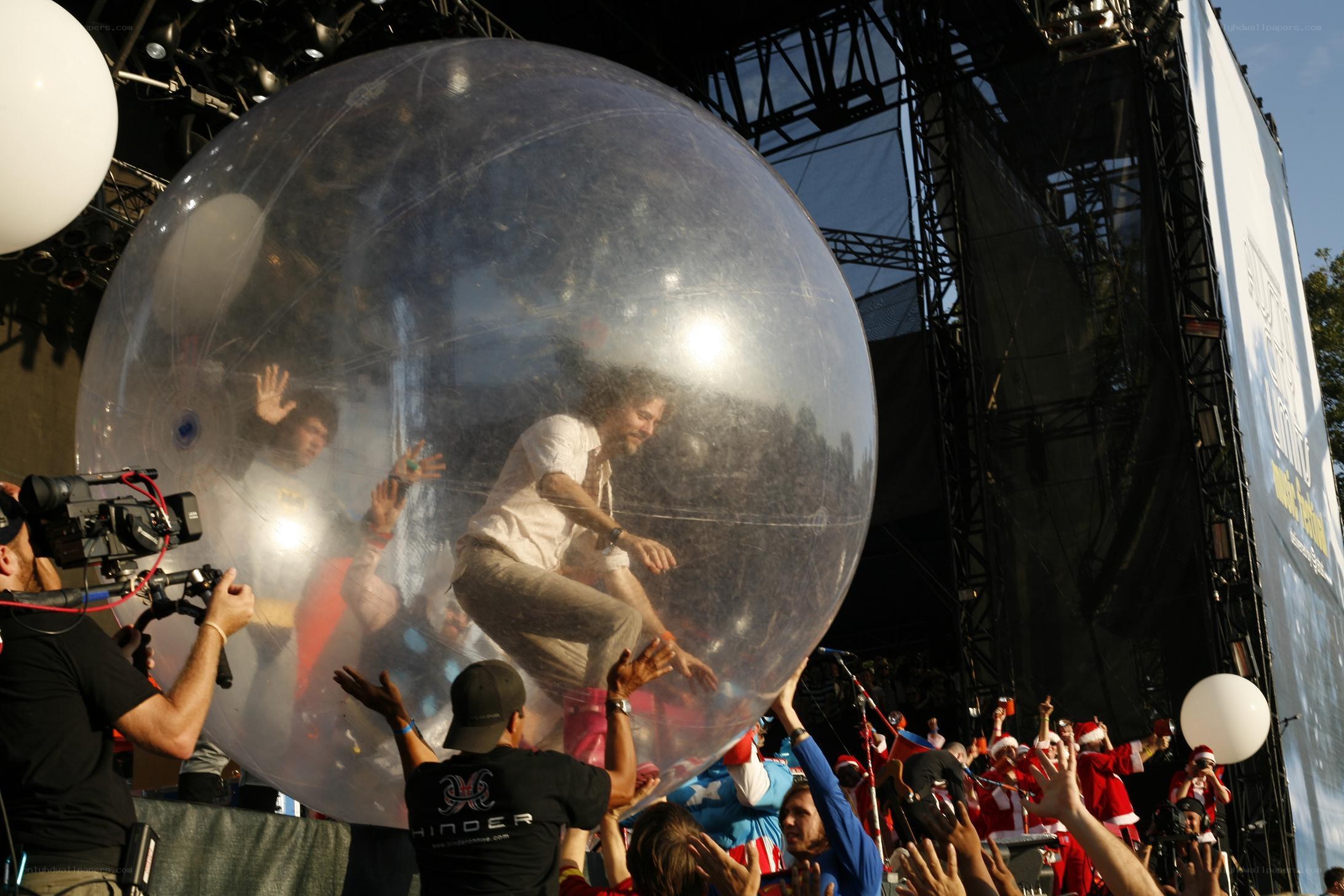 Man in inflatable bubble at concert
