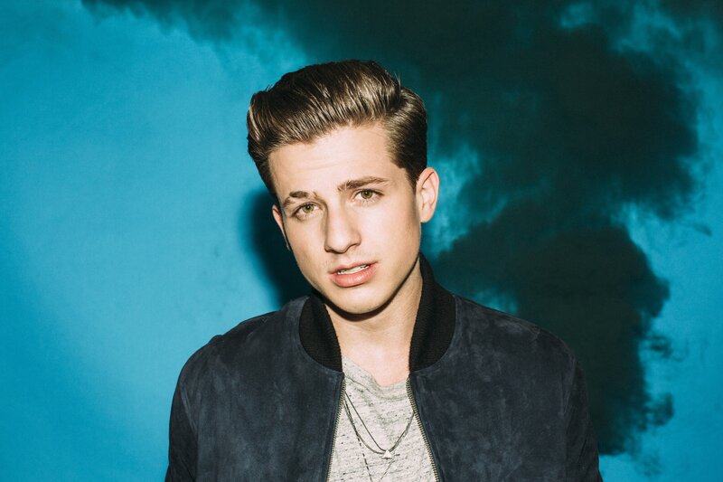 man in jacket against blue background