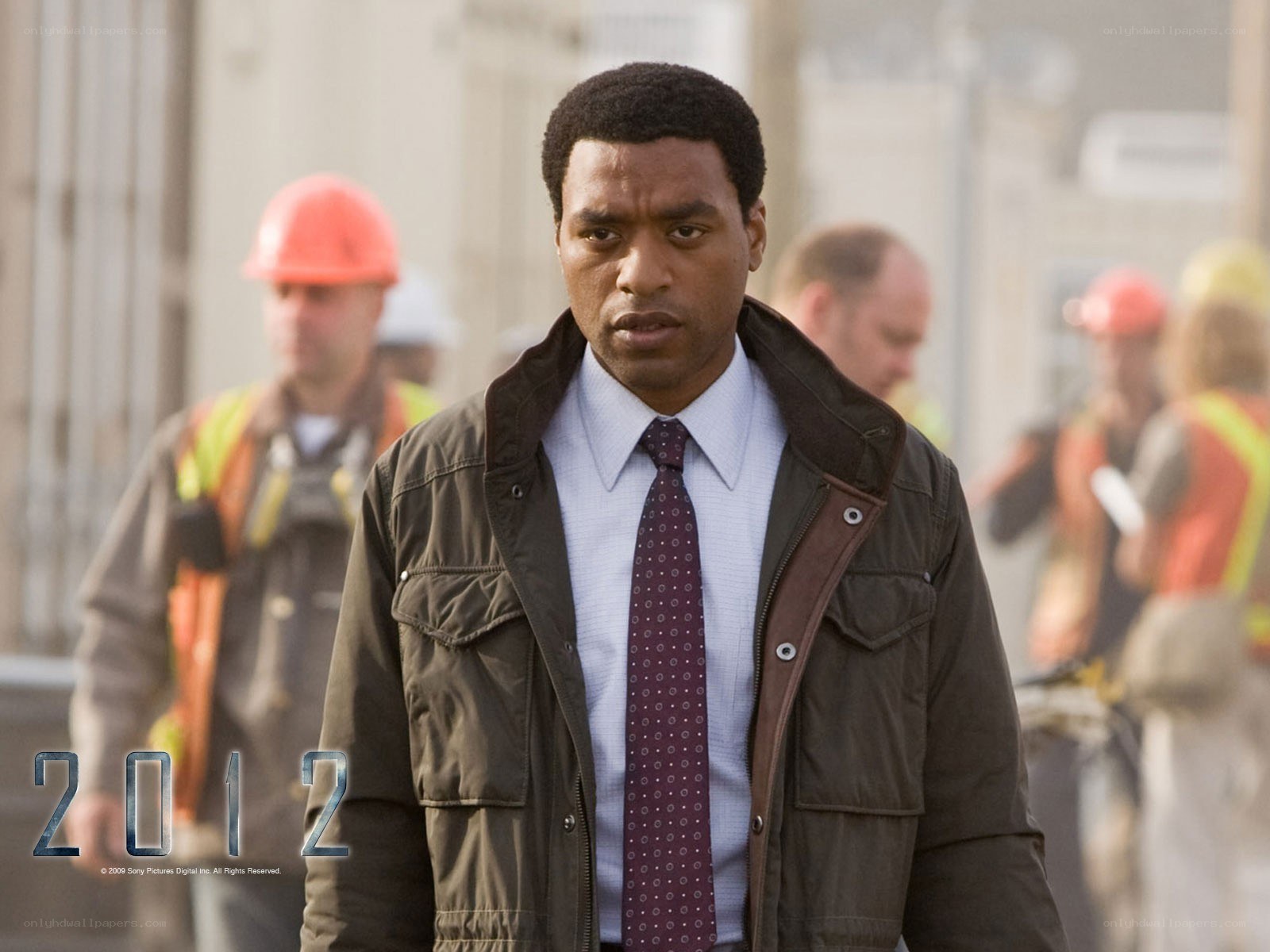 Man in jacket at construction site