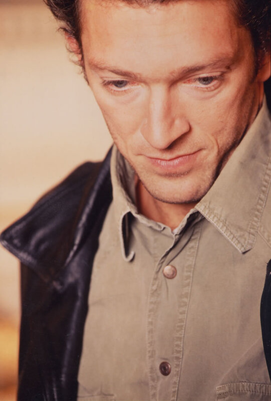 man in jacket looking down