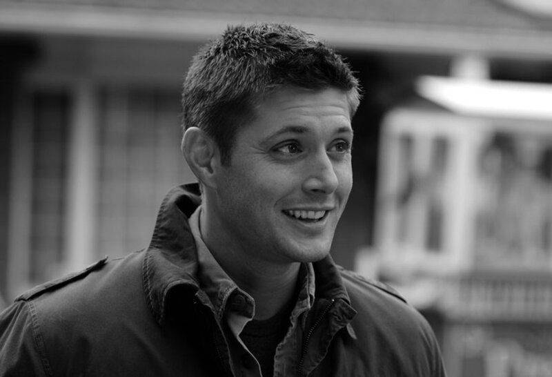 Man in Jacket Smiling — Black