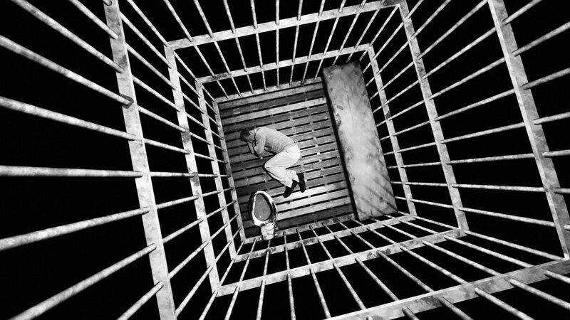 Man in Jail Cell