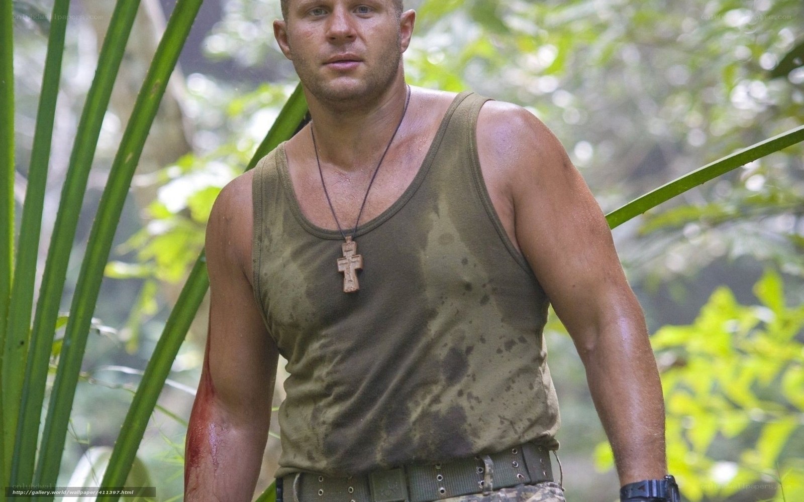 man in jungle with cross