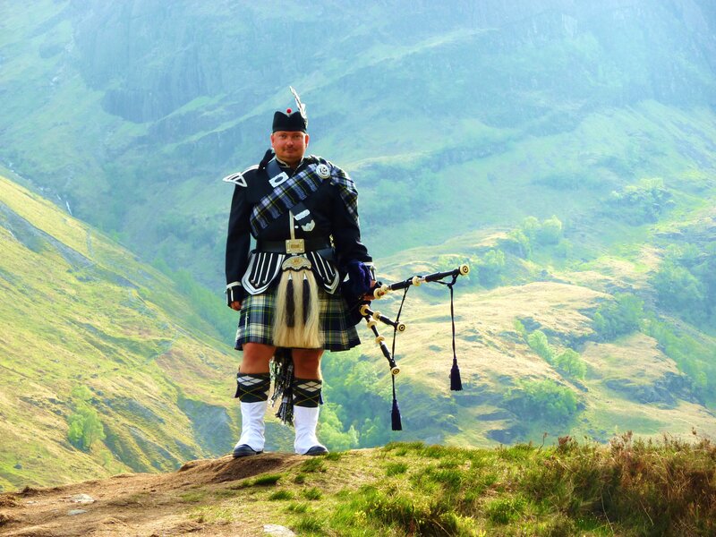 Man in Kilt Holding Bagpipes