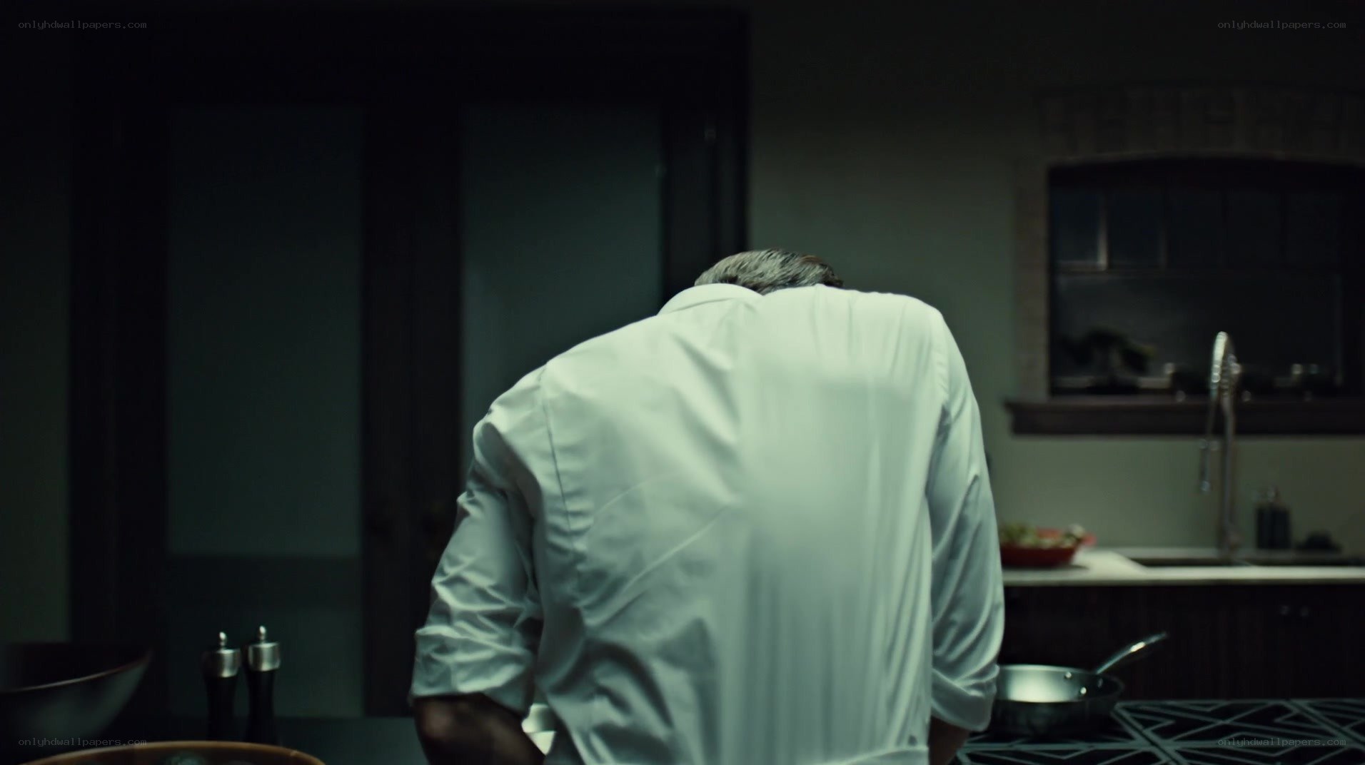 man in kitchen from behind