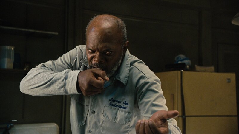 man in kitchen making fist