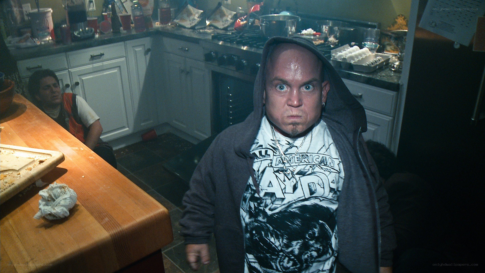 Man in kitchen with shocked expression