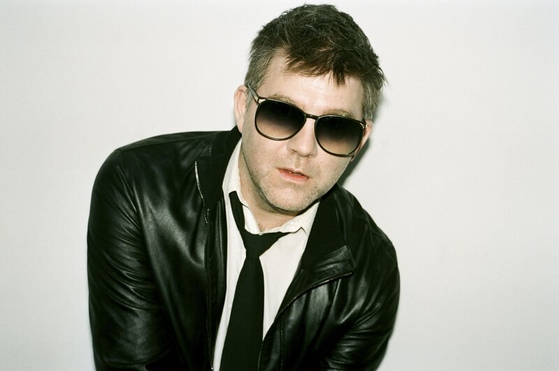 man in leather jacket and sunglasses
