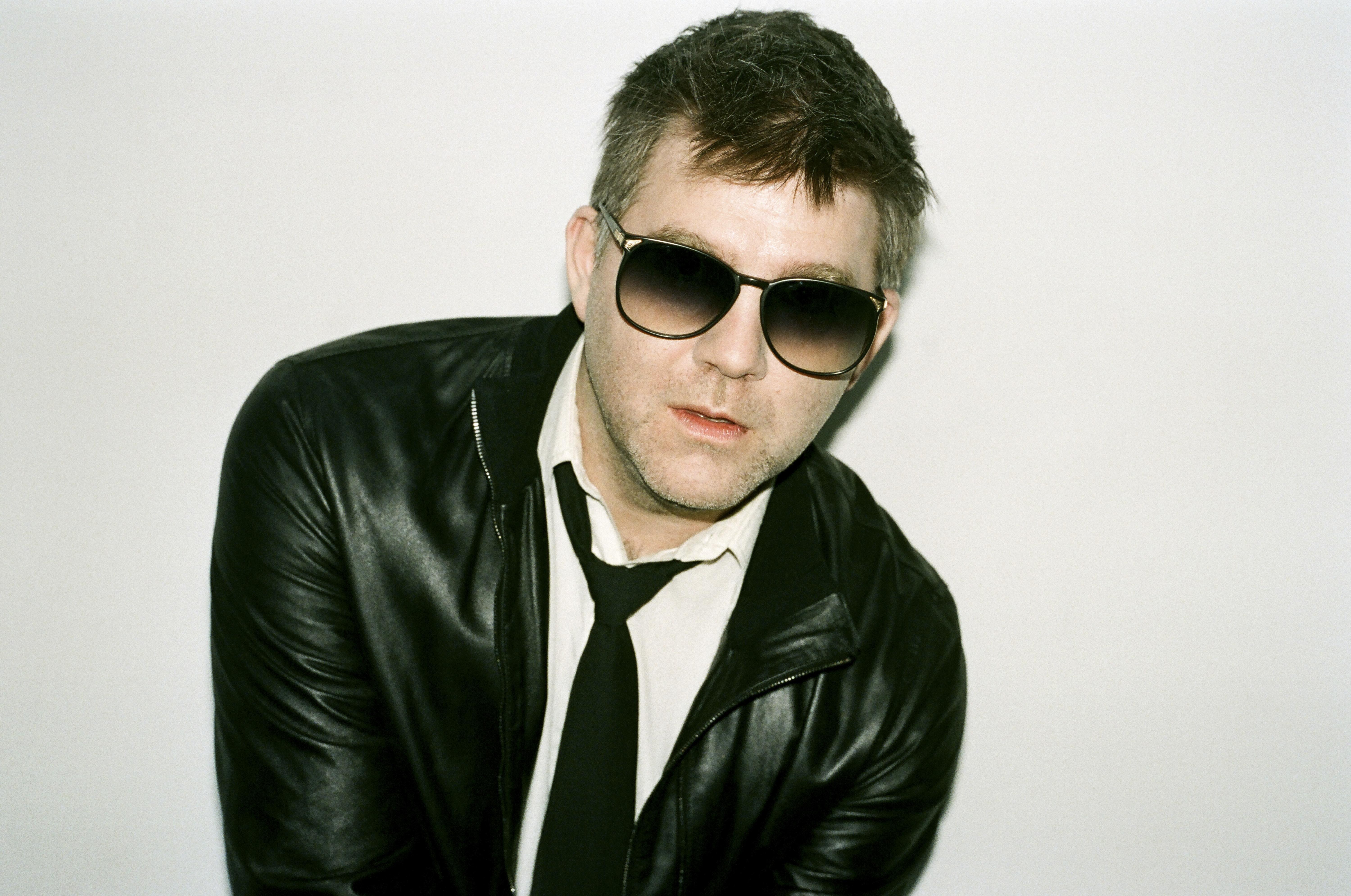 man in leather jacket and sunglasses