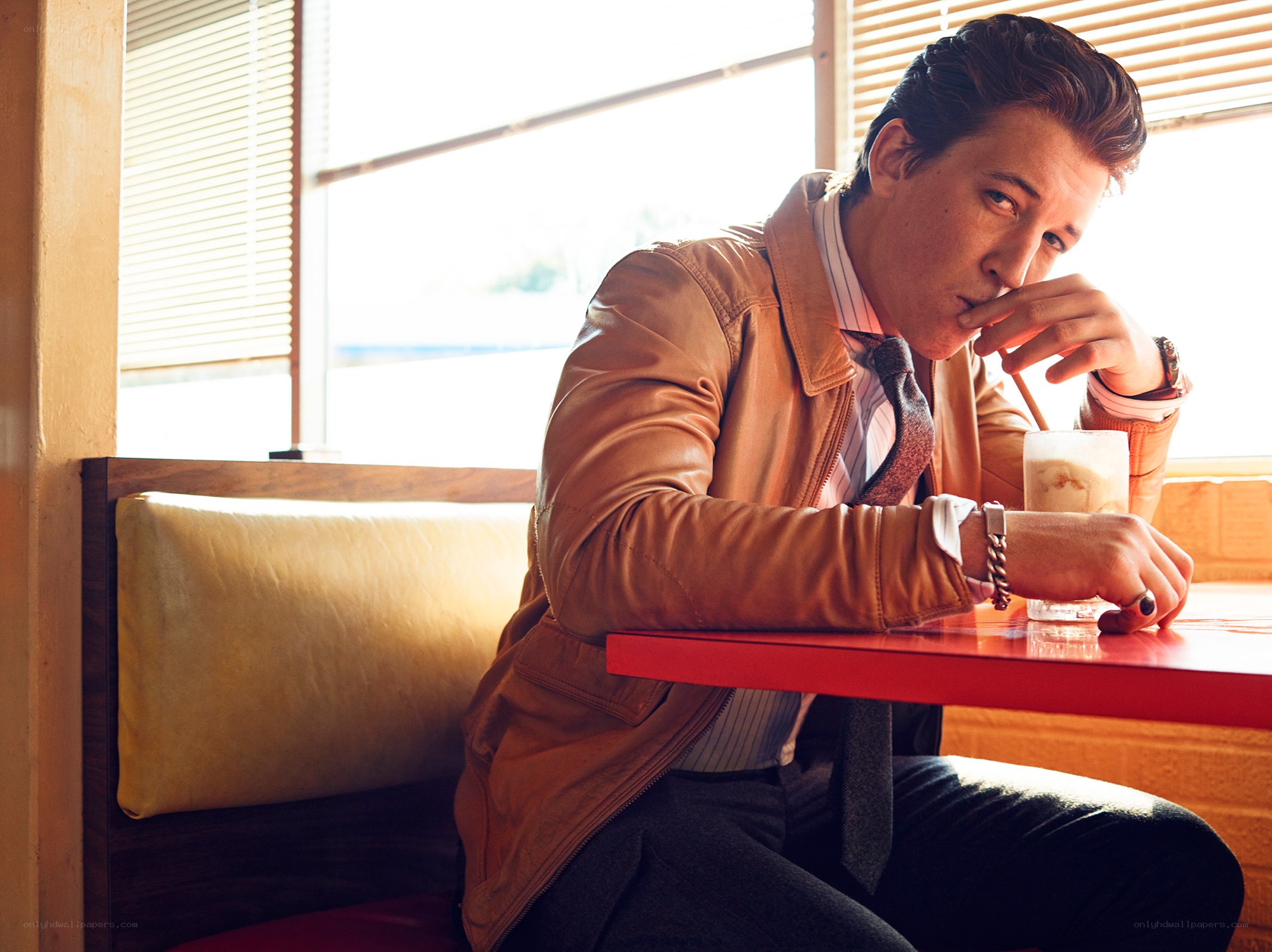 Man in leather jacket at diner
