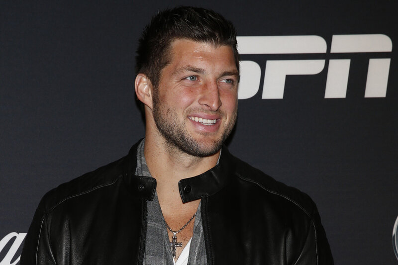 man in leather jacket at event