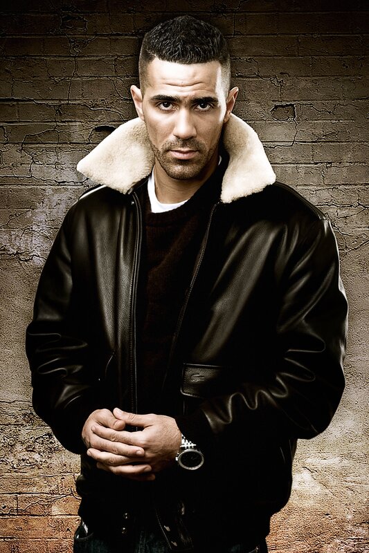 Man in Leather Jacket — Black, Serious, Photograph, Brick Wall, Leather Jacket