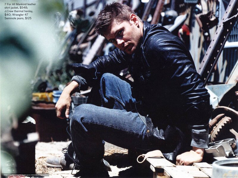 man in leather jacket crouching