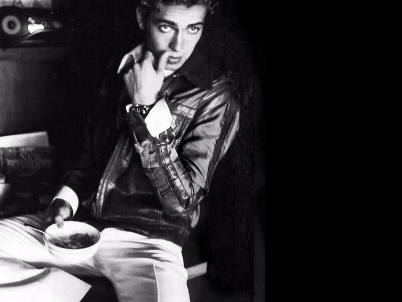 man in leather jacket eating