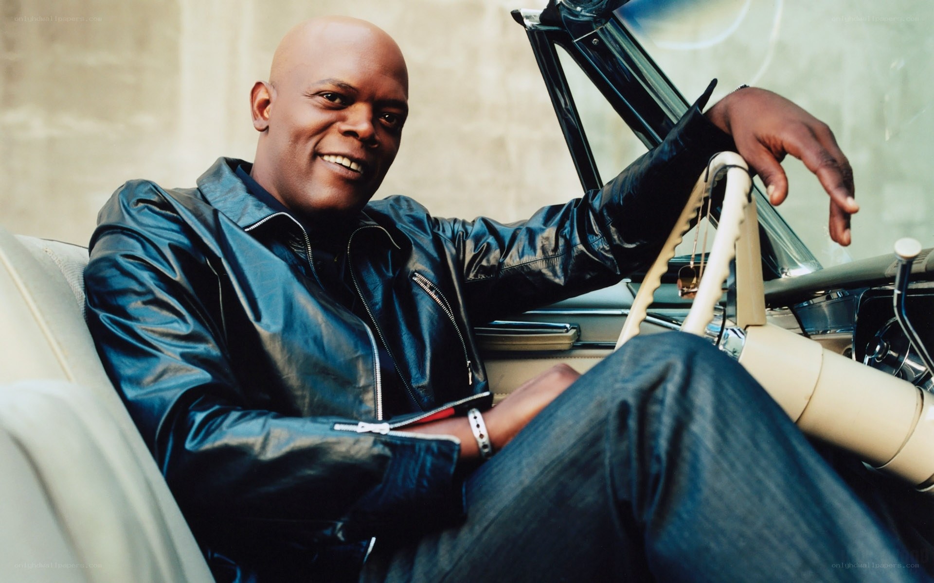 man in leather jacket in car