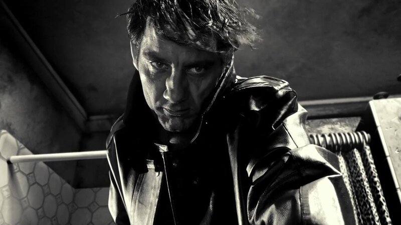 man in leather jacket looking down