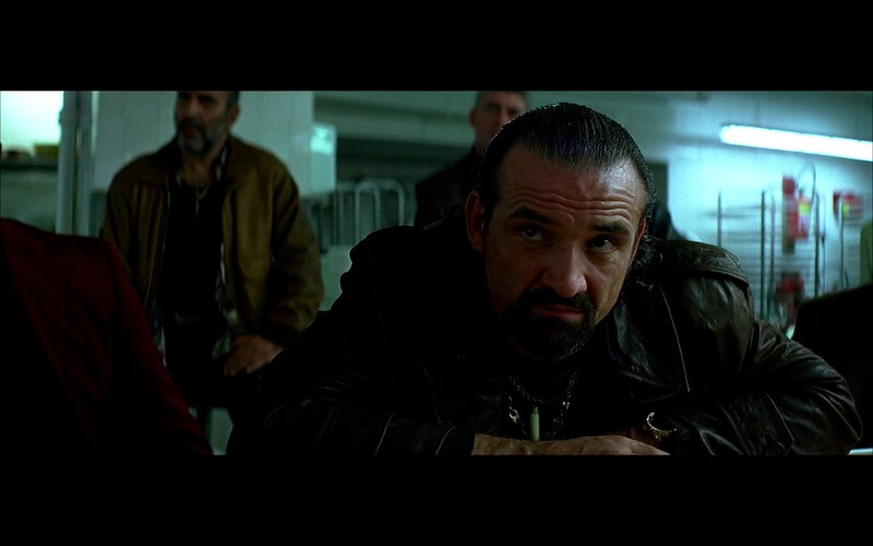 man in leather jacket looking intensely