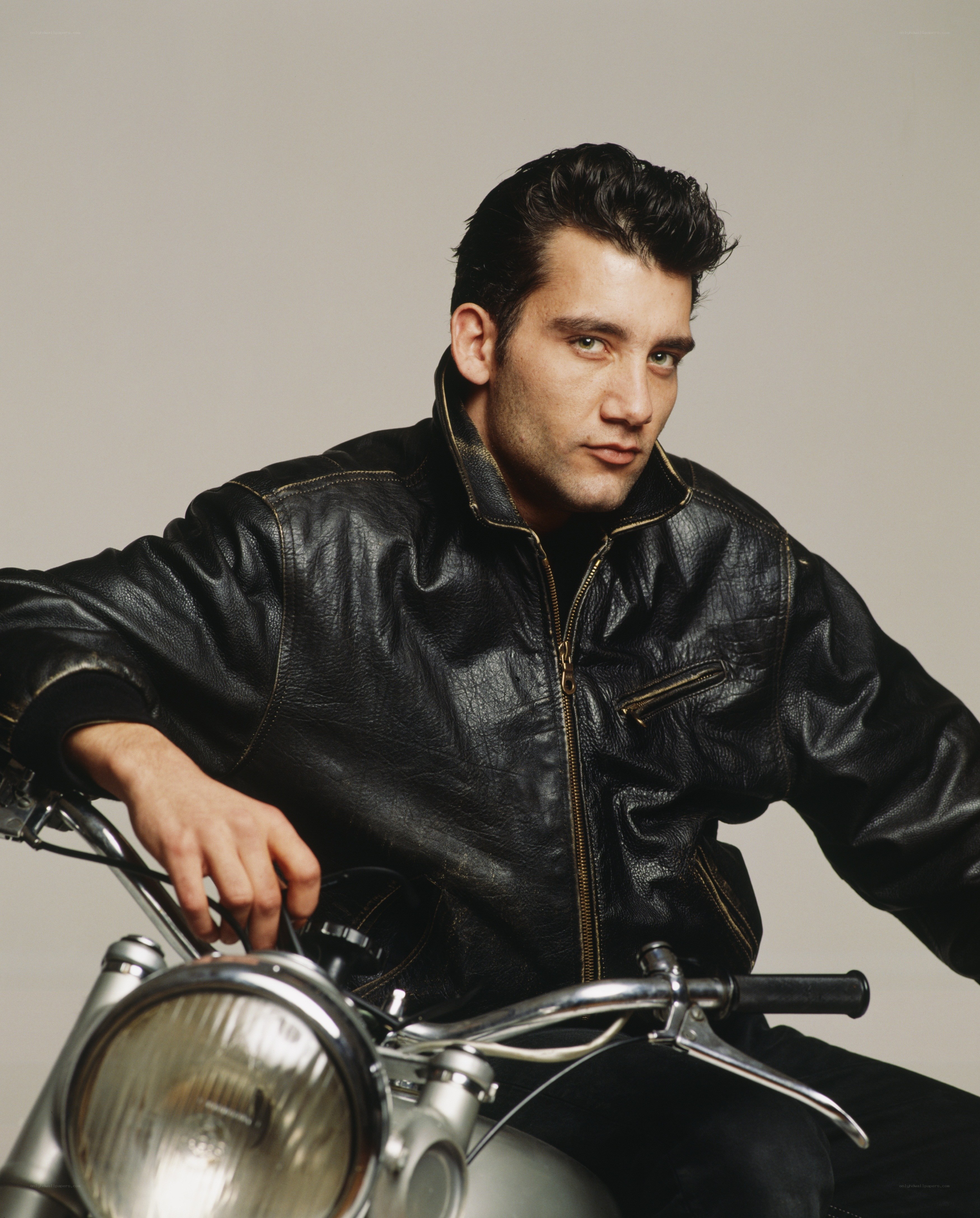 man in leather jacket on motorcycle