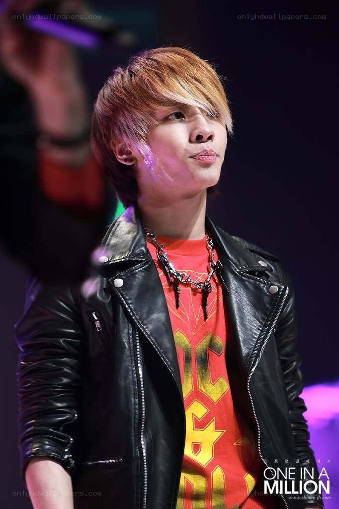 man in leather jacket on stage