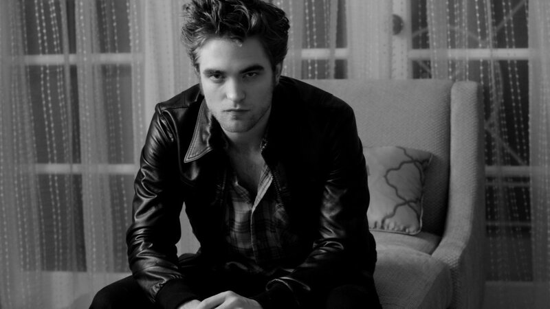 man in leather jacket sitting