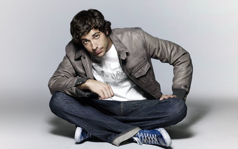 man in leather jacket sitting