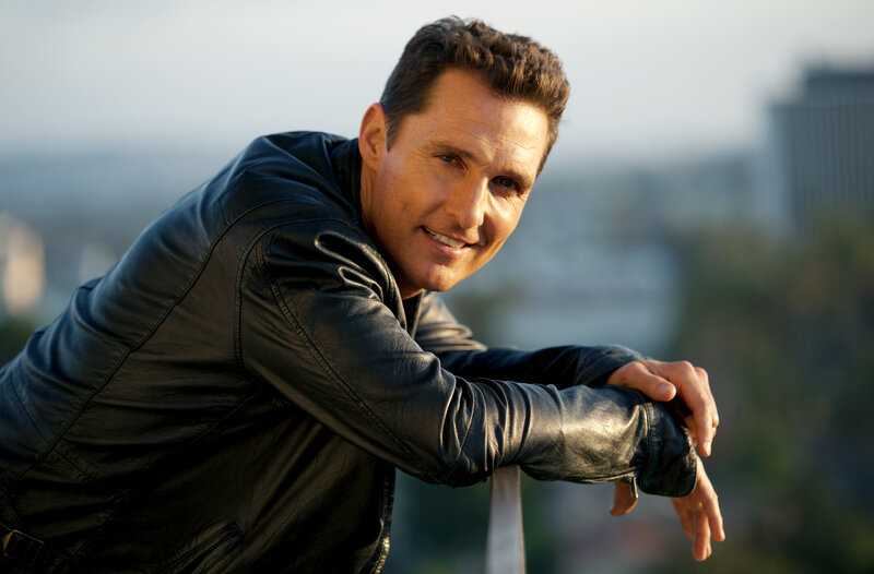 Man in leather jacket smiling
