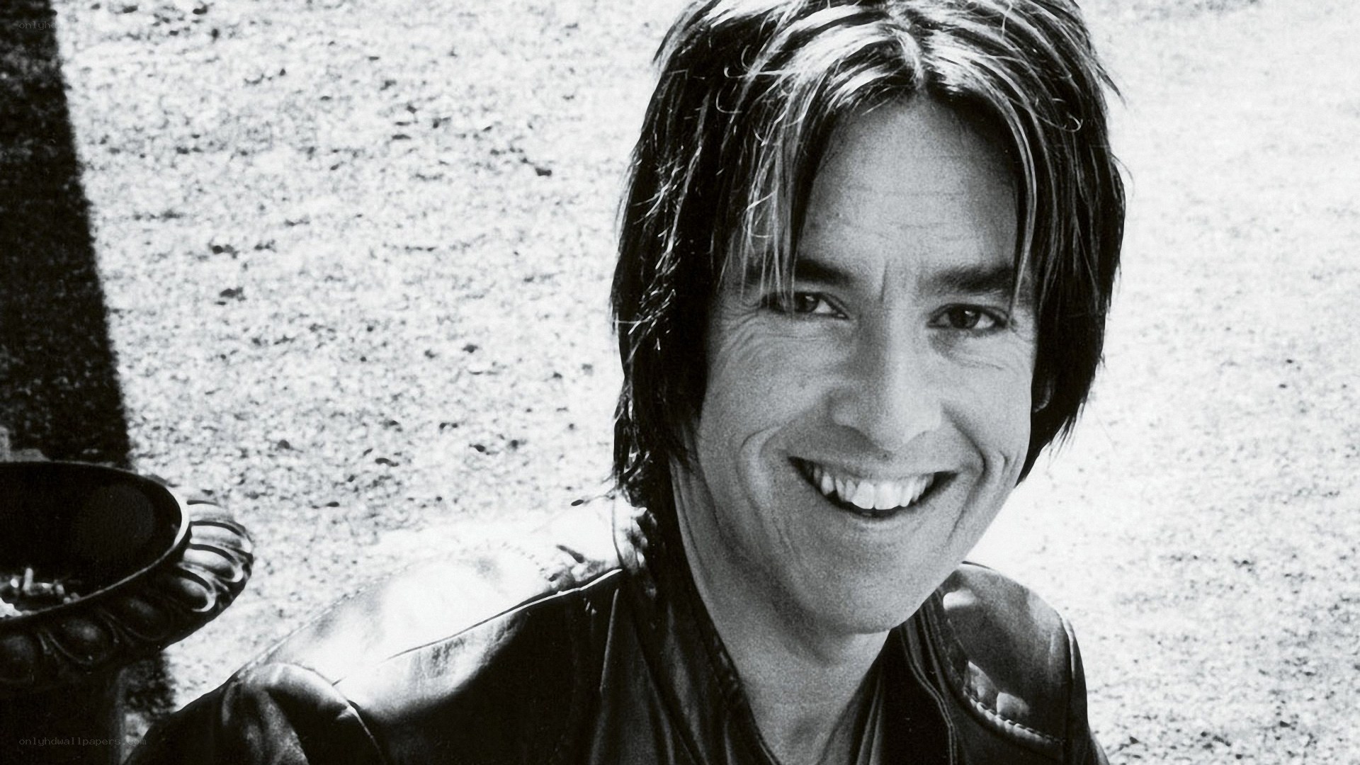 man in leather jacket smiling