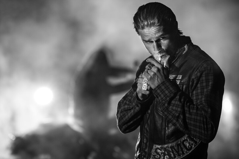 man in leather jacket smoking