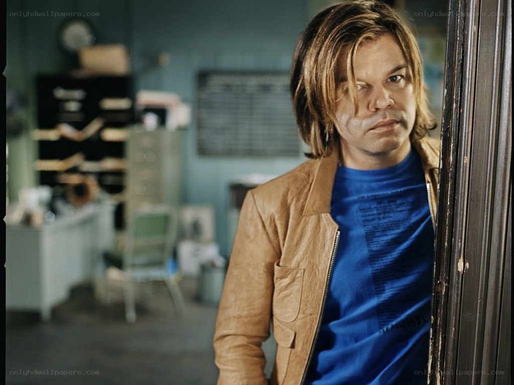 Man in leather jacket standing