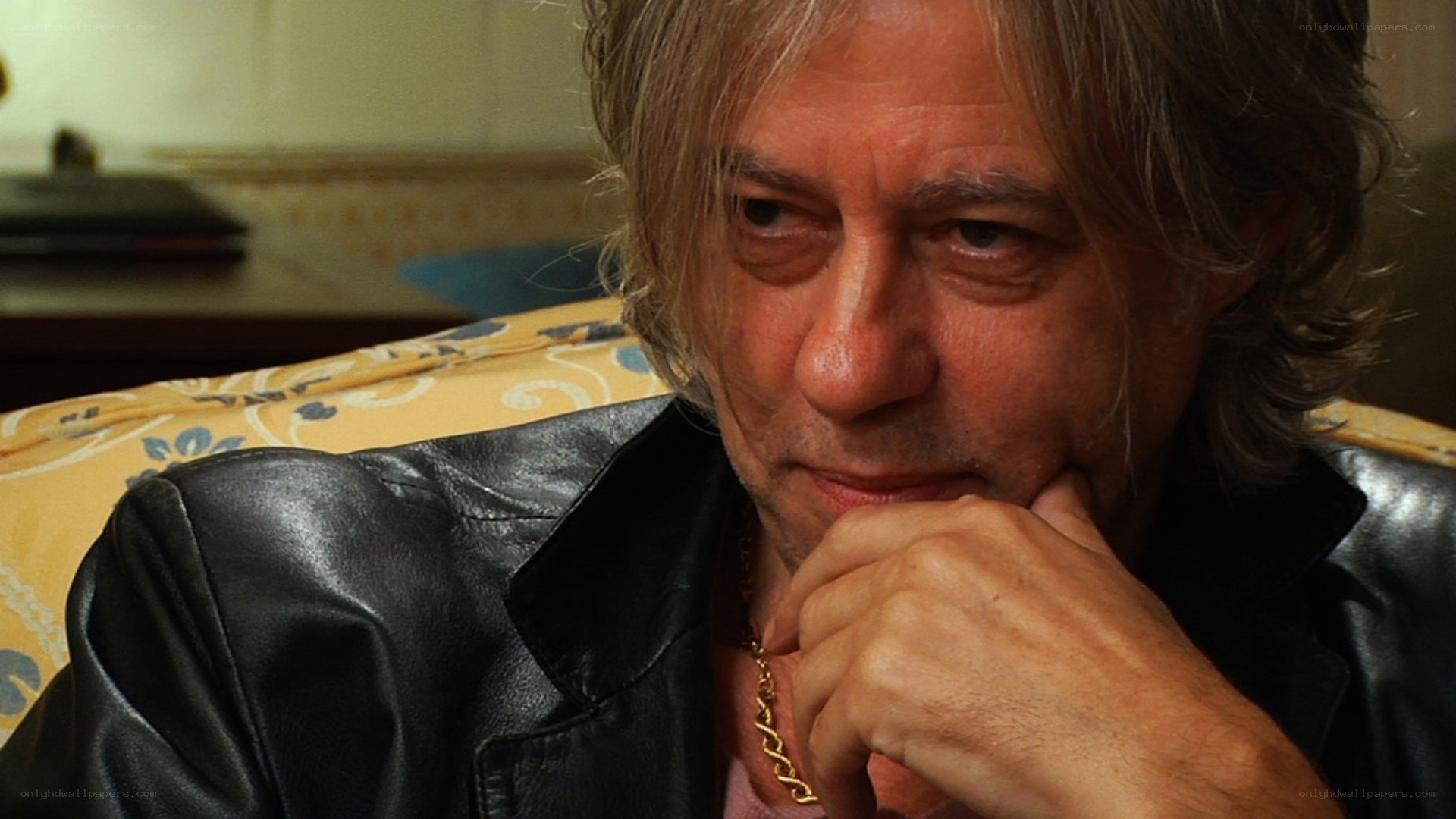man in leather jacket thinking