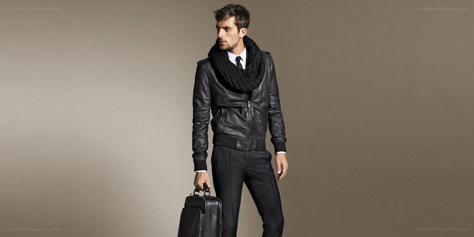 Man in leather jacket with briefcase