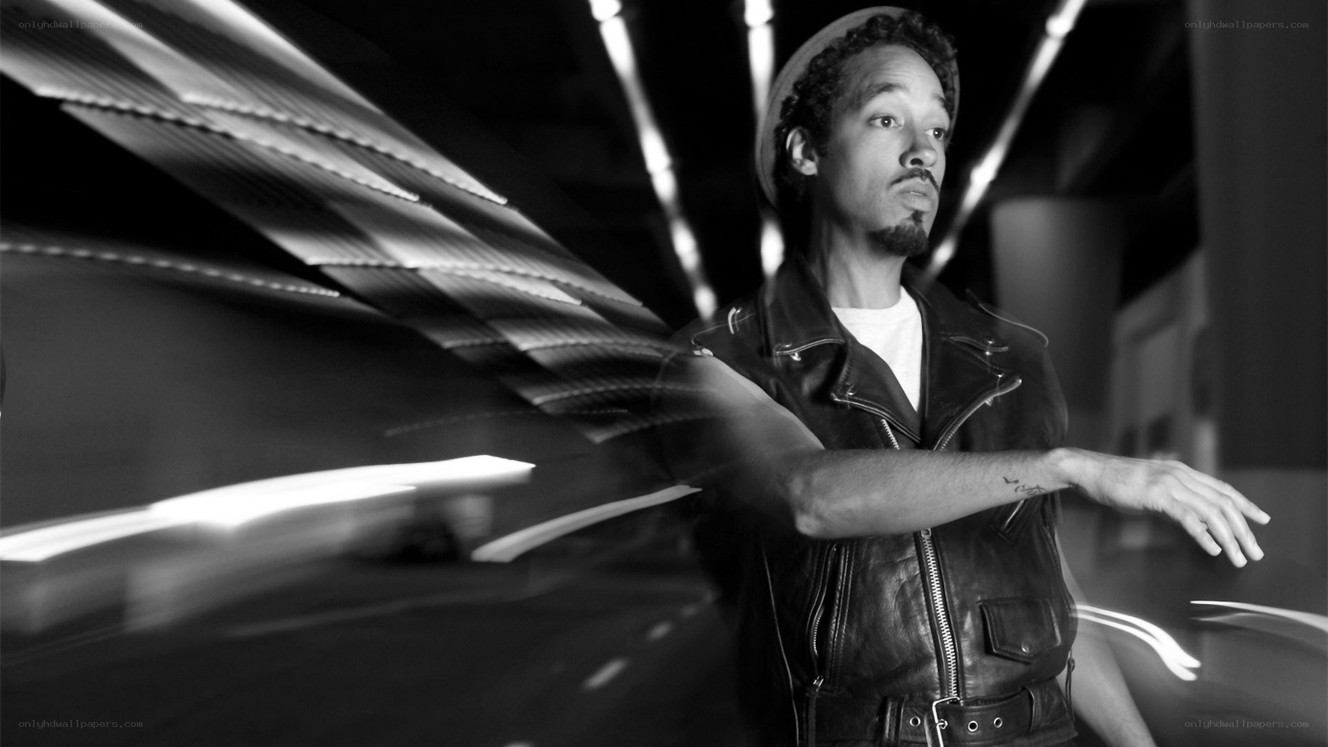 man in leather jacket with light trails