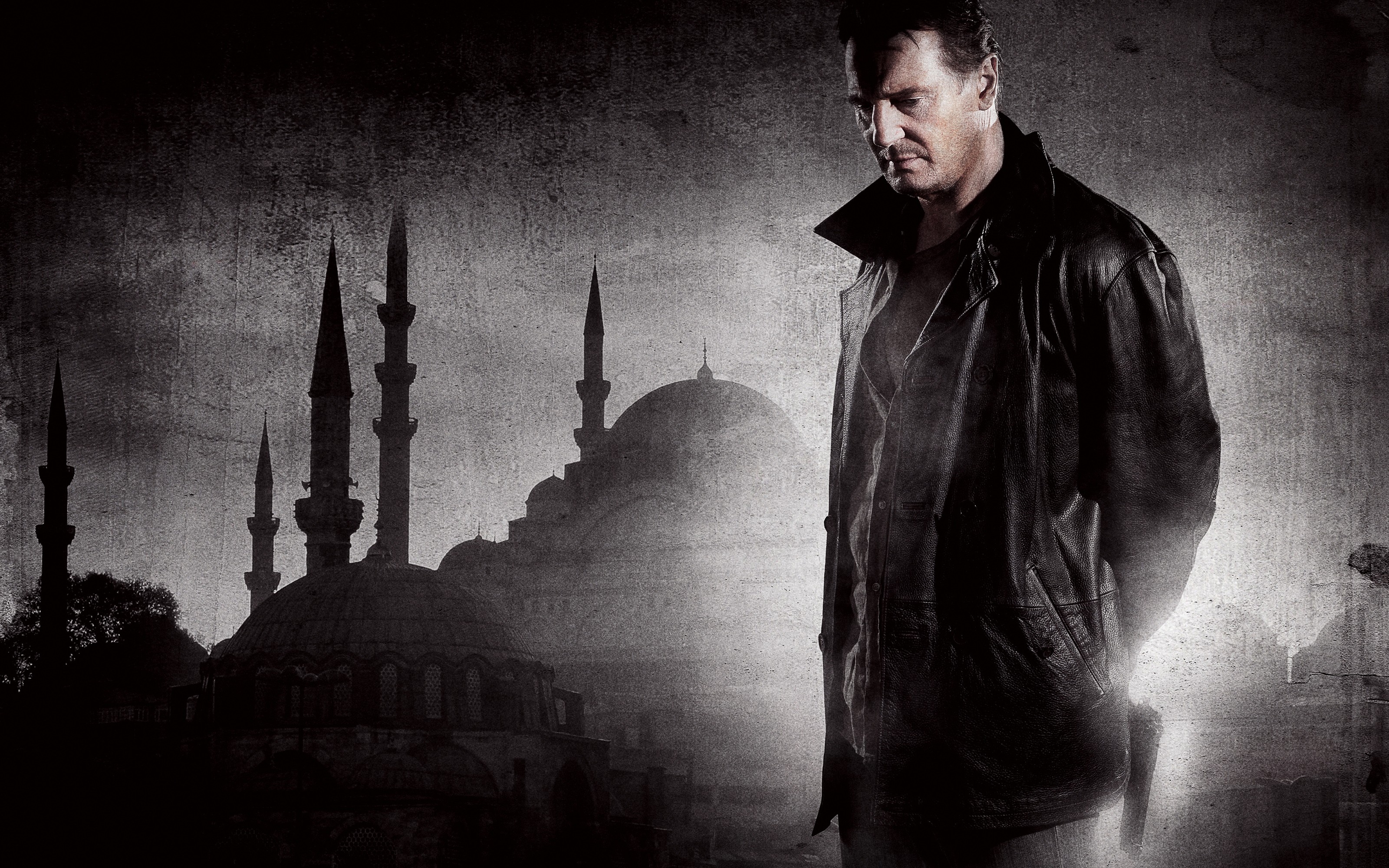 Man in leather jacket with mosque