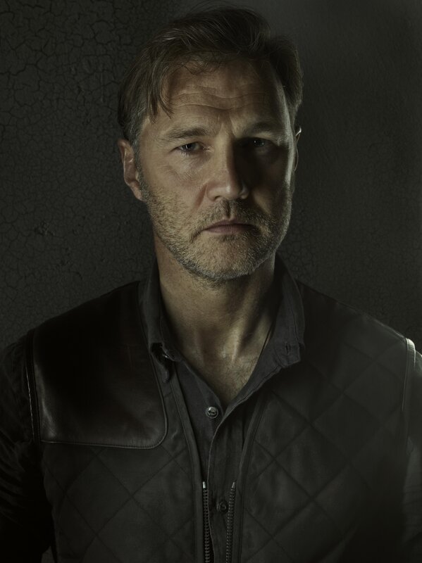 man in leather vest