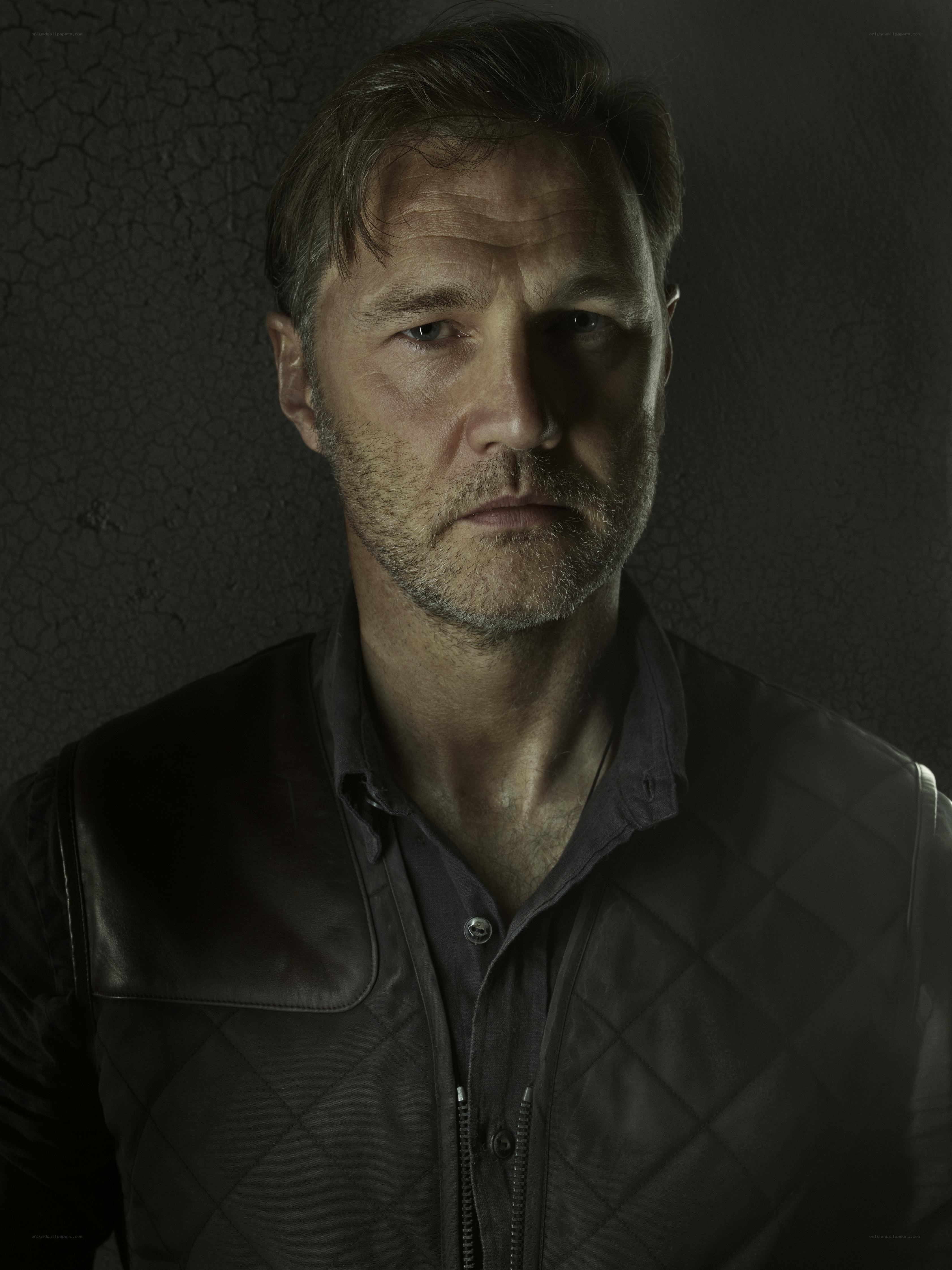 man in leather vest