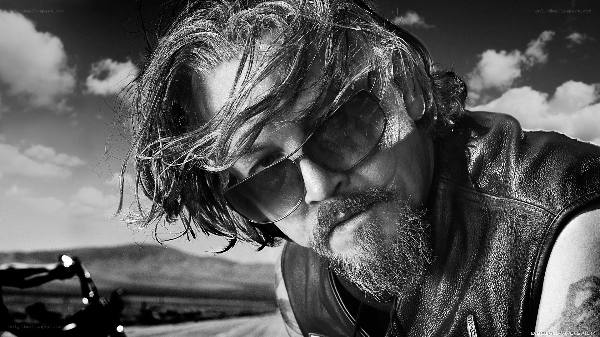 man in leather vest with sunglasses