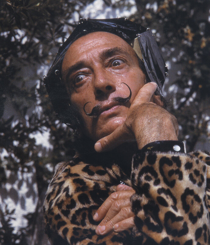 Man in leopard coat with mustache