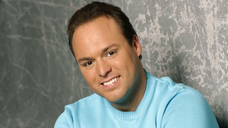 man in light blue sweater
