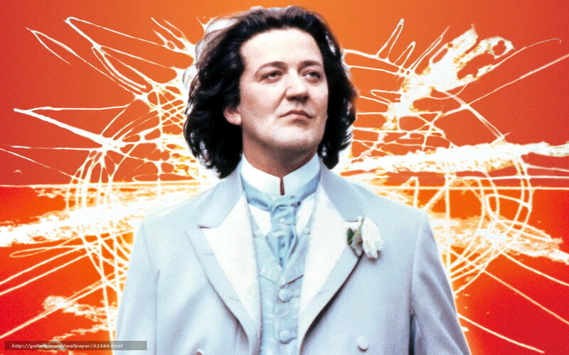 Man in light suit on orange background